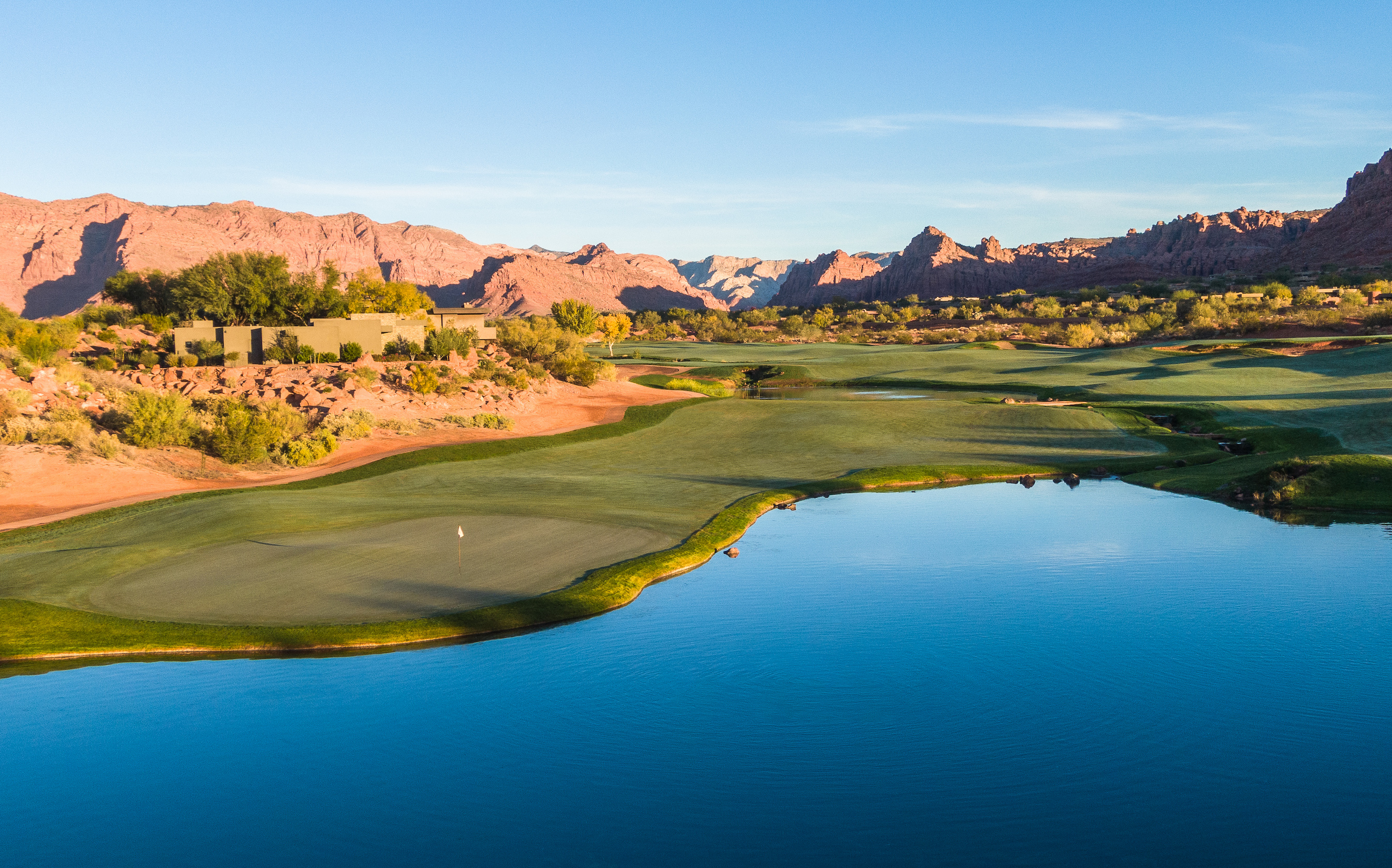 Panoramic view of Entrada at Snow Canyon with red rock formations and Snow Canyon State Park in background